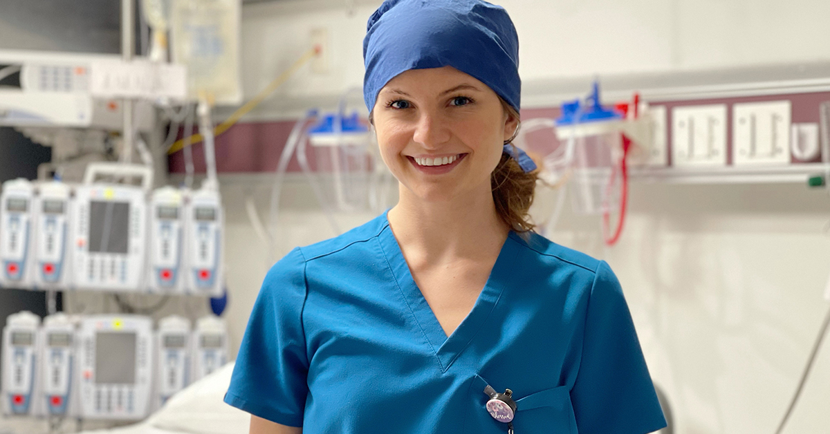 Smiling physician assistant in scrubs